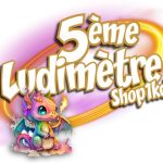 Logo du 5ème Ludimètre Shop1kdo, avec mascotte dragon multicolore